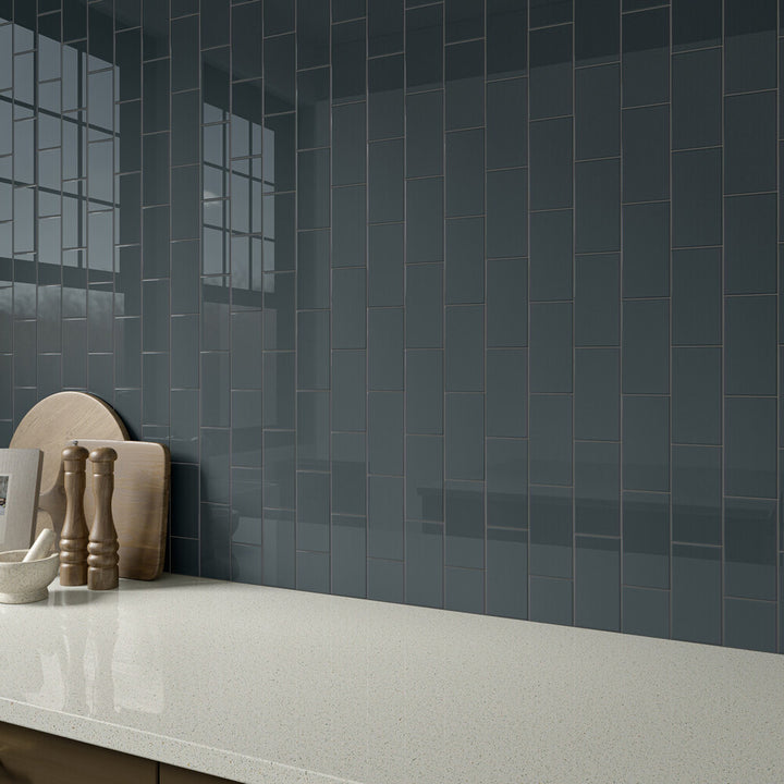 Roomscene showing Color Wheel Classic Chalkboard 3x6 glossy glazed ceramic tile, where its deep charcoal shade and brilliant shine create a bold, modern statement.