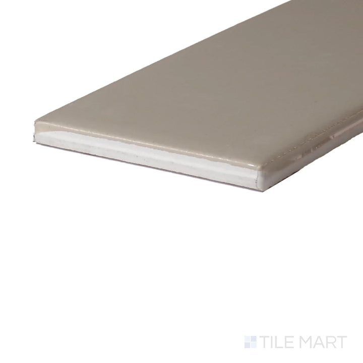 Angled close-up of Color Wheel Classic Urban Putty 3X6 Matte Glazed Ceramic, showcasing its soft, earthy hue with a smooth matte finish.