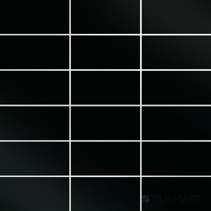 A top-down view of the Color Wheel Classic Black 3x6 glossy glazed ceramic tile reveals a deep black shade with a mirror-like finish, adding depth and sophistication to any design.