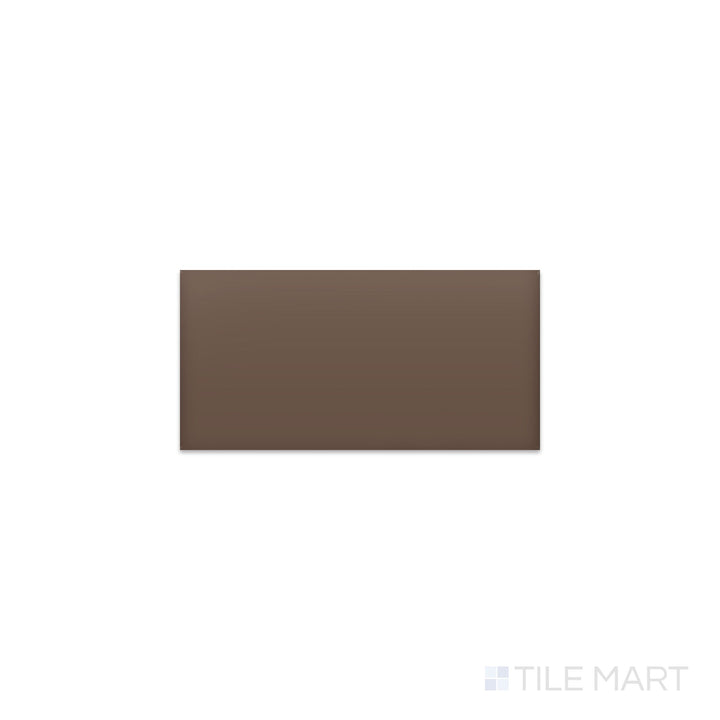 Slanted perspective of Color Wheel Classic Artisan Brown 3x6 matte glazed ceramic tile, emphasizing a warm earthy brown color, a velvety matte texture, and a sleek rectangular shape.  