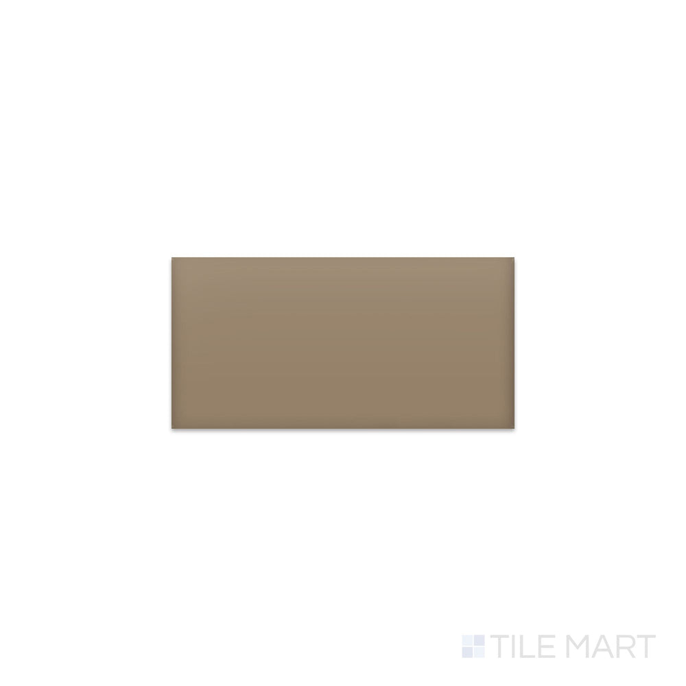 Angled shot of Color Wheel Classic Elemental Tan 3x6 matte glazed ceramic tile, featuring a soft tan tone with a contemporary matte finish in a timeless subway tile format.  