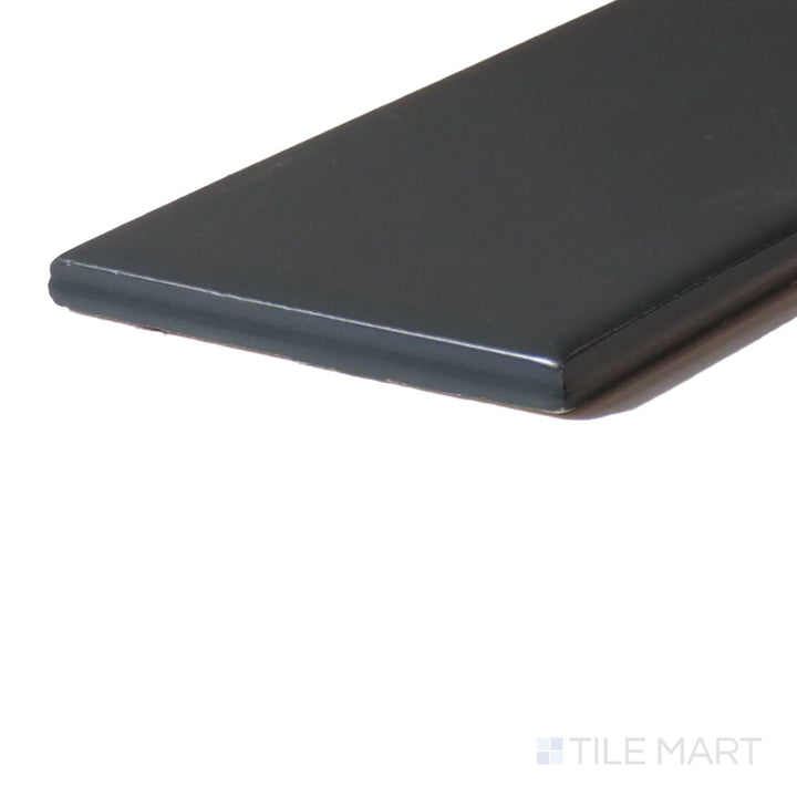 Close-up corner shot of Color Wheel Classic Chalkboard 3X6 Matte Glazed Ceramic, featuring its deep black shade and velvety matte finish for bold designs.