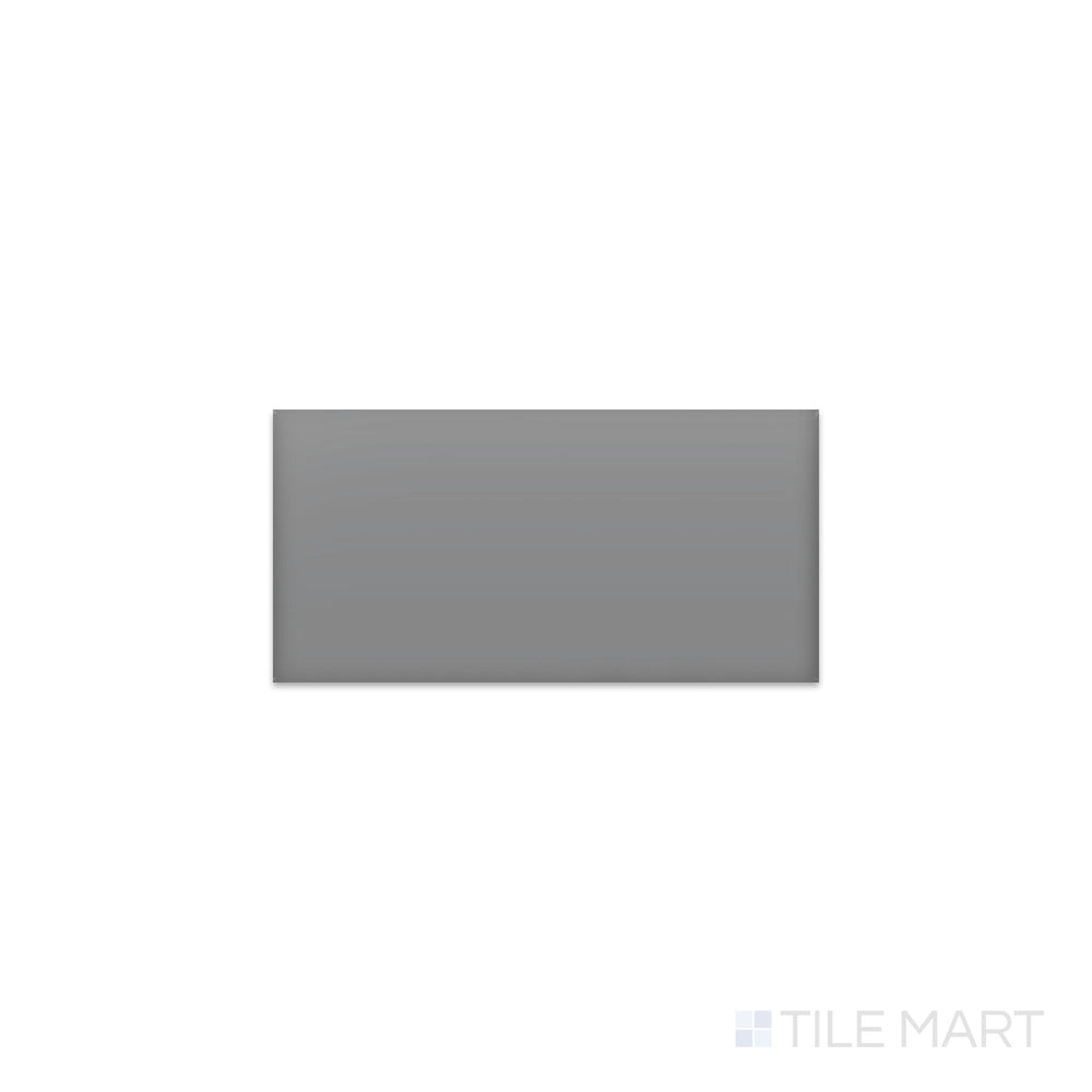 Slanted perspective of Color Wheel Classic Suede Gray 3x6 matte glazed ceramic tile, emphasizing a muted gray shade, a soft matte texture, and a clean rectangular profile.  