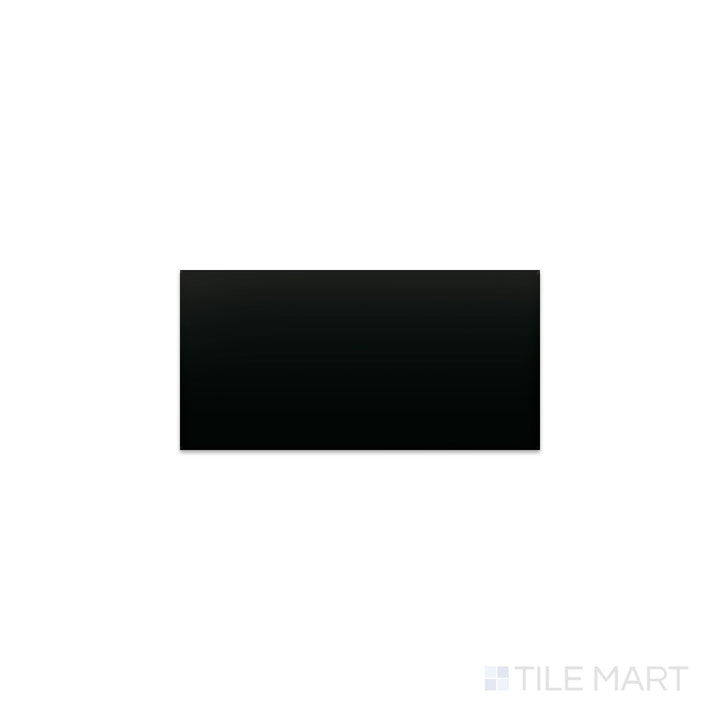 Angled shot of Color Wheel Classic Black 3x6 matte glazed ceramic tile, featuring a sophisticated black finish with a smooth, non-reflective surface in a subway-style format.  