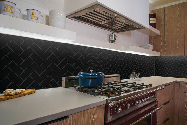 In this styled view, Color Wheel Classic Black 3x6 matte glazed ceramic tile delivers a rich, deep tone with a smooth, non-glossy finish for a more grounded look.