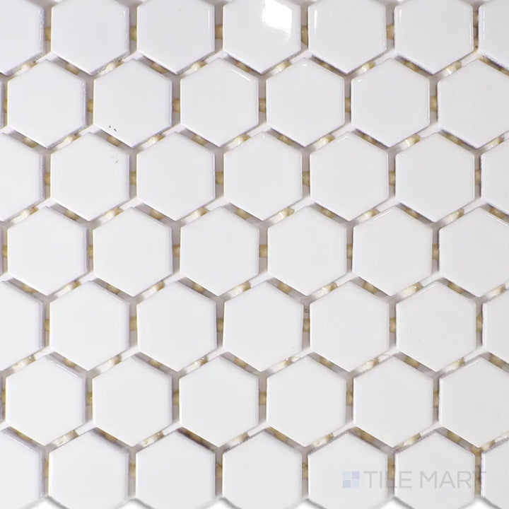 A top-down view of the Color Wheel Mosaic Arctic White 1.5" hexagon glossy glazed ceramic tile captures its crisp white shade and polished finish, bringing a clean, modern touch to backsplashes and accent walls.