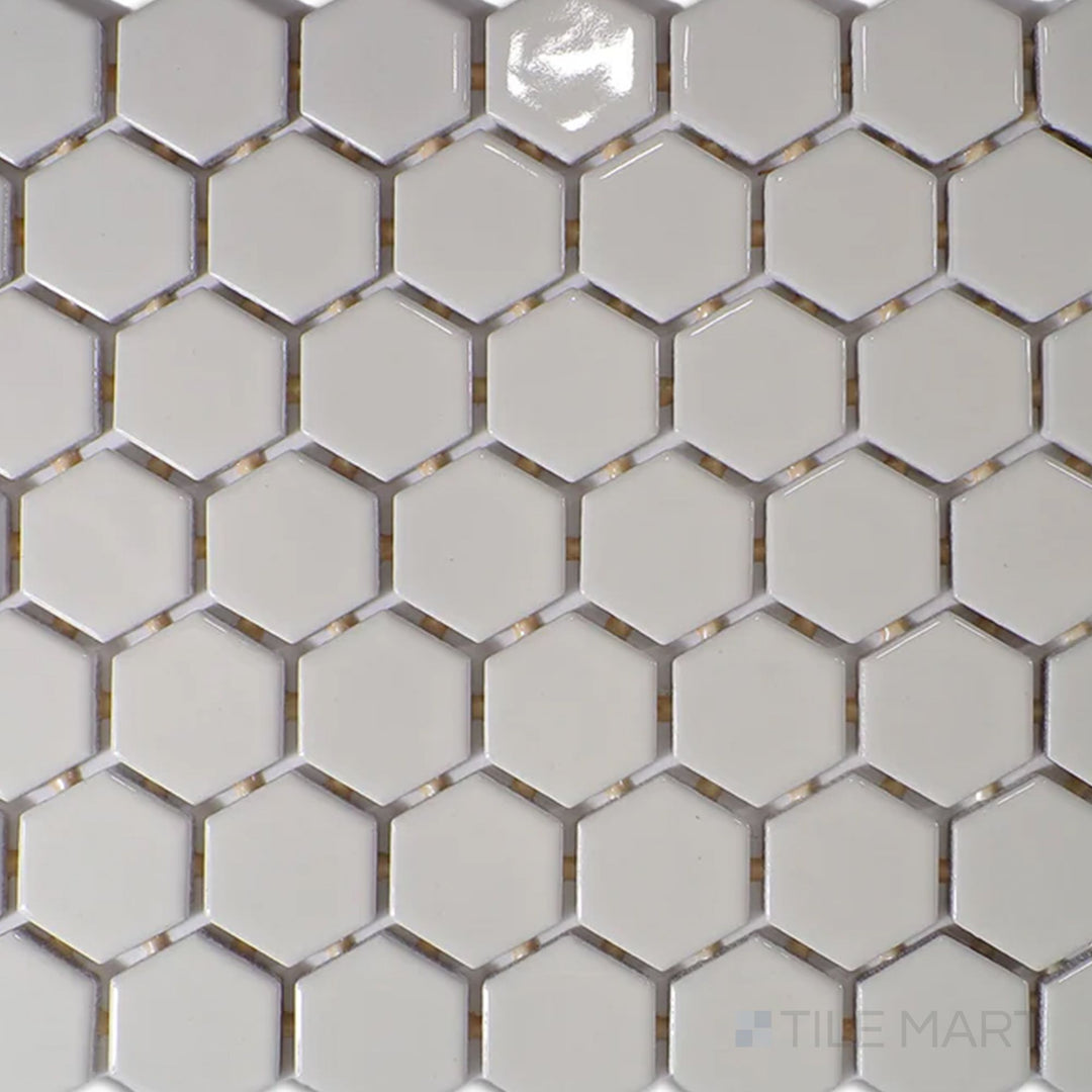 Captured from above, the Color Wheel Mosaic Biscuit 1.5" hexagon glossy glazed ceramic tile showcases a soft, warm beige tone with a lustrous surface, ideal for adding subtle elegance to any space.