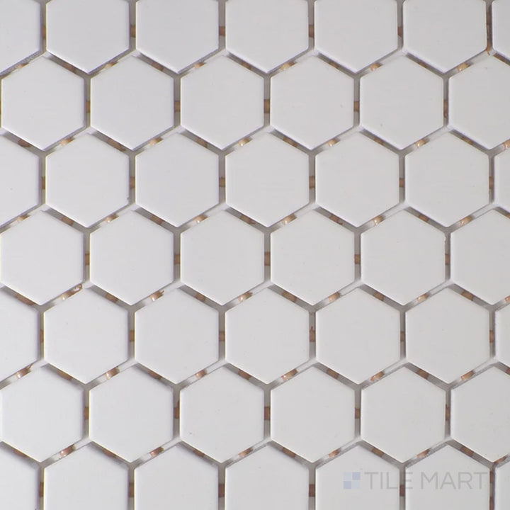Viewed from the top, the Color Wheel Mosaic Arctic White 1.5" hexagon matte glazed ceramic tile displays a clean, bright white shade with a soft, non-glossy surface, perfect for minimalist and contemporary spaces.