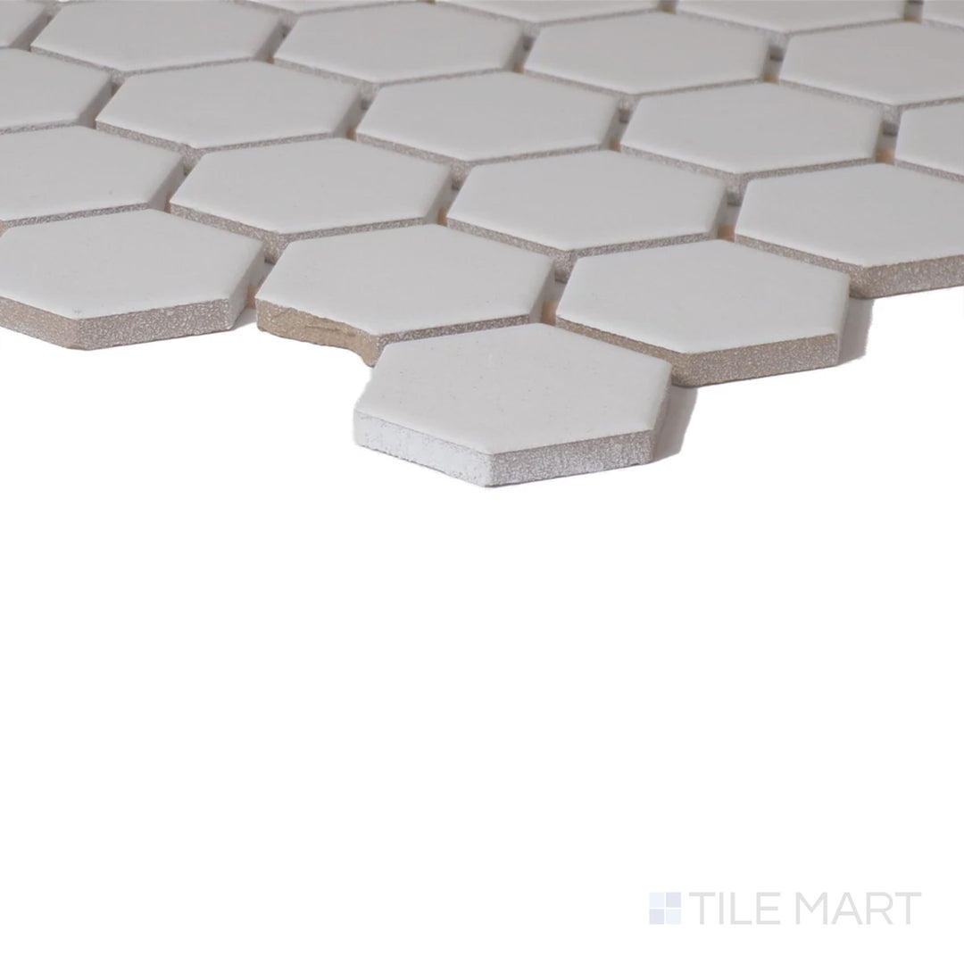 Corner shot of Color Wheel Mosaic Arctic White 1.5" Hexagon Matte Glazed Ceramic, capturing its pure white tone with a subtle, non-reflective finish.