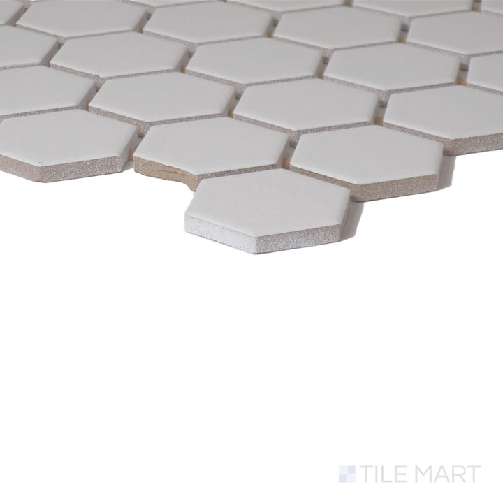 Corner shot of Color Wheel Mosaic Arctic White 1.5" Hexagon Matte Glazed Ceramic, capturing its pure white tone with a subtle, non-reflective finish.