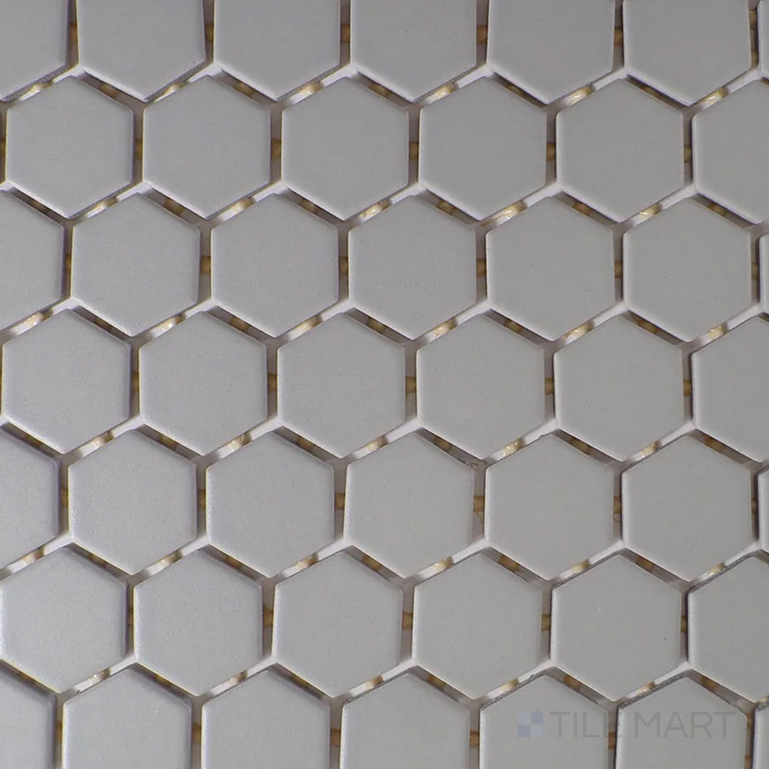 Captured from above, the Color Wheel Mosaic Desert Gray 1.5" hexagon matte glazed ceramic tile features a versatile gray tone with a soft matte surface, perfect for modern and industrial aesthetics.