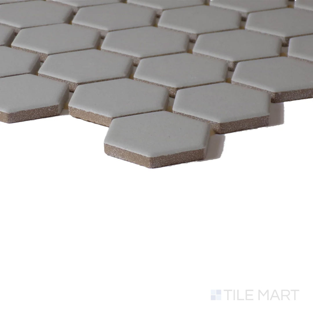 Close-up corner perspective of Color Wheel Mosaic Desert Gray 1.5" Hexagon Matte Glazed Ceramic, showcasing its neutral gray hue with a natural matte surface.