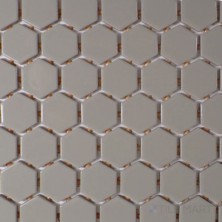 The overhead perspective highlights the Color Wheel Mosaic Architectural Gray 1.5" hexagon glossy glazed ceramic tile, with its sleek gray tone and high-shine finish enhancing depth and light reflection.