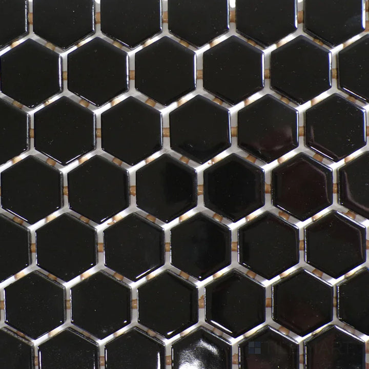 The overhead perspective showcases the Color Wheel Mosaic Black 1.5" hexagon glossy glazed ceramic tile, featuring a deep black tone with a mirror-like finish, ideal for bold and elegant designs.