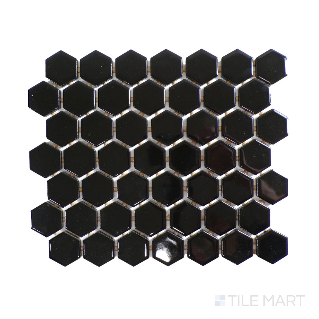Diagonal view of Color Wheel Mosaic Black 1.5" hexagon glossy glazed ceramic tile, featuring a bold black tone with a glossy finish in a striking hexagonal format.  