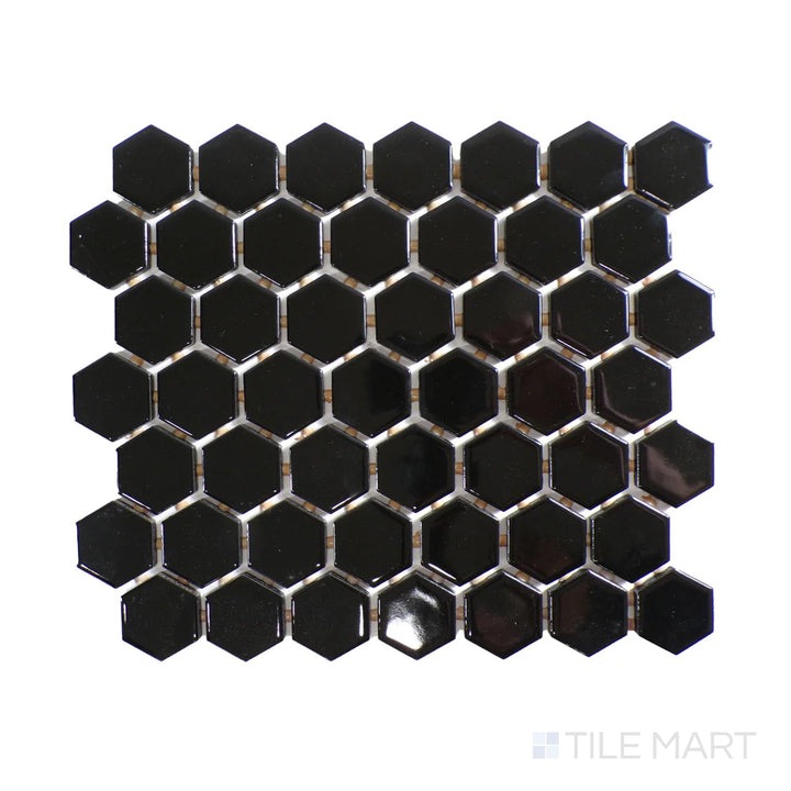 Diagonal view of Color Wheel Mosaic Black 1.5" hexagon glossy glazed ceramic tile, featuring a bold black tone with a glossy finish in a striking hexagonal format.  