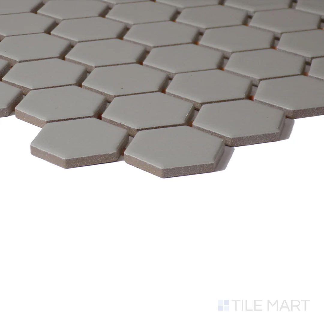 Side perspective of Color Wheel Mosaic Architectural Gray 1.5" Hexagon Matte Glazed Ceramic, highlighting its modern gray tone with a soft, matte texture.