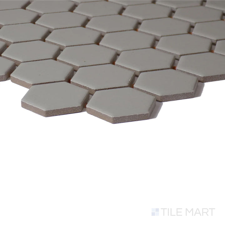 Side perspective of Color Wheel Mosaic Architectural Gray 1.5" Hexagon Matte Glazed Ceramic, highlighting its modern gray tone with a soft, matte texture.