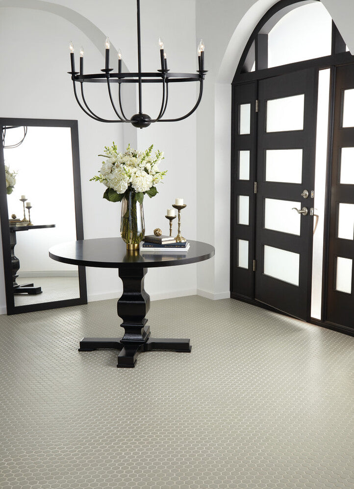 Roomscene showcasing Color Wheel Mosaic Architectural Gray 1.5" hexagon matte glazed ceramic tile, where the structured pattern and muted gray tone create geometric sophistication.