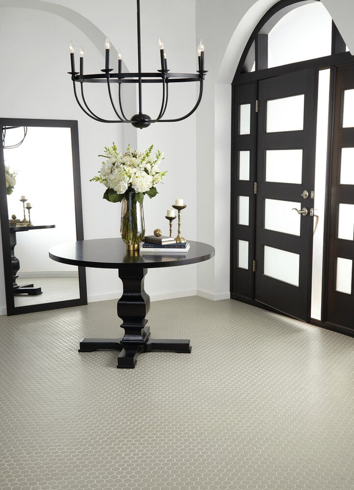 Roomscene showcasing Color Wheel Mosaic Architectural Gray 1.5" hexagon matte glazed ceramic tile, where the structured pattern and muted gray tone create geometric sophistication.