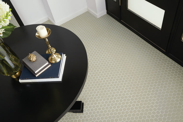 Seen in a completed interior, the Color Wheel Mosaic Architectural Gray 1.5 inch hexagon matte glazed ceramic tile adds subtle texture and geometric interest