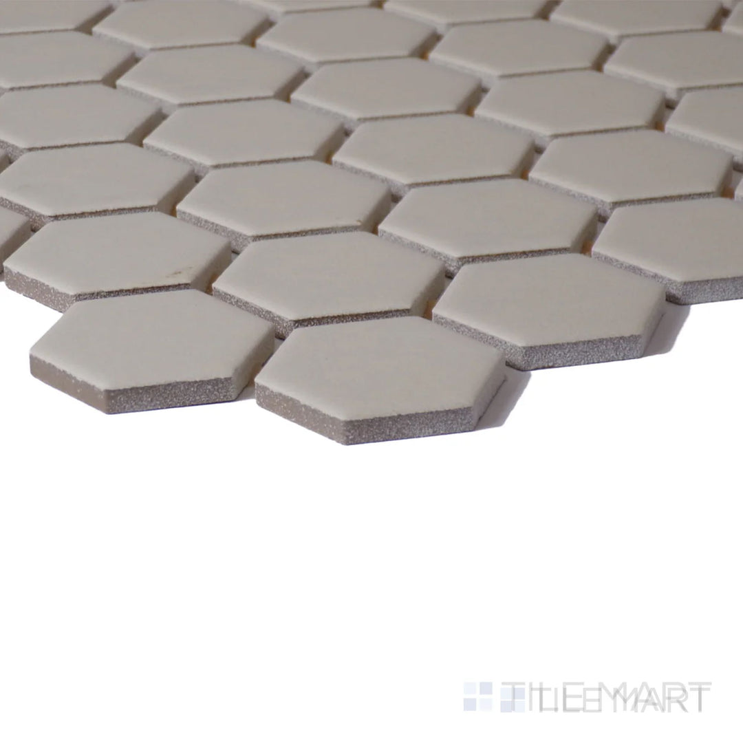 Corner shot of Color Wheel Mosaic Urban Putty 1.5" Hexagon Matte Glazed Ceramic, featuring a muted, warm-toned hue with a natural matte finish.