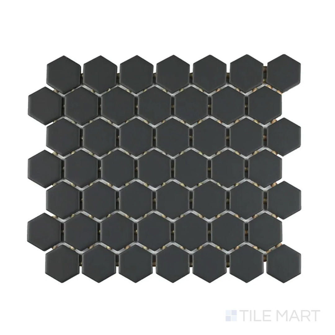 Slanted perspective of Color Wheel Mosaic Chalkboard 1.5" hexagon matte glazed ceramic tile, emphasizing a deep black color with a soft matte finish in a striking hexagonal arrangement.  