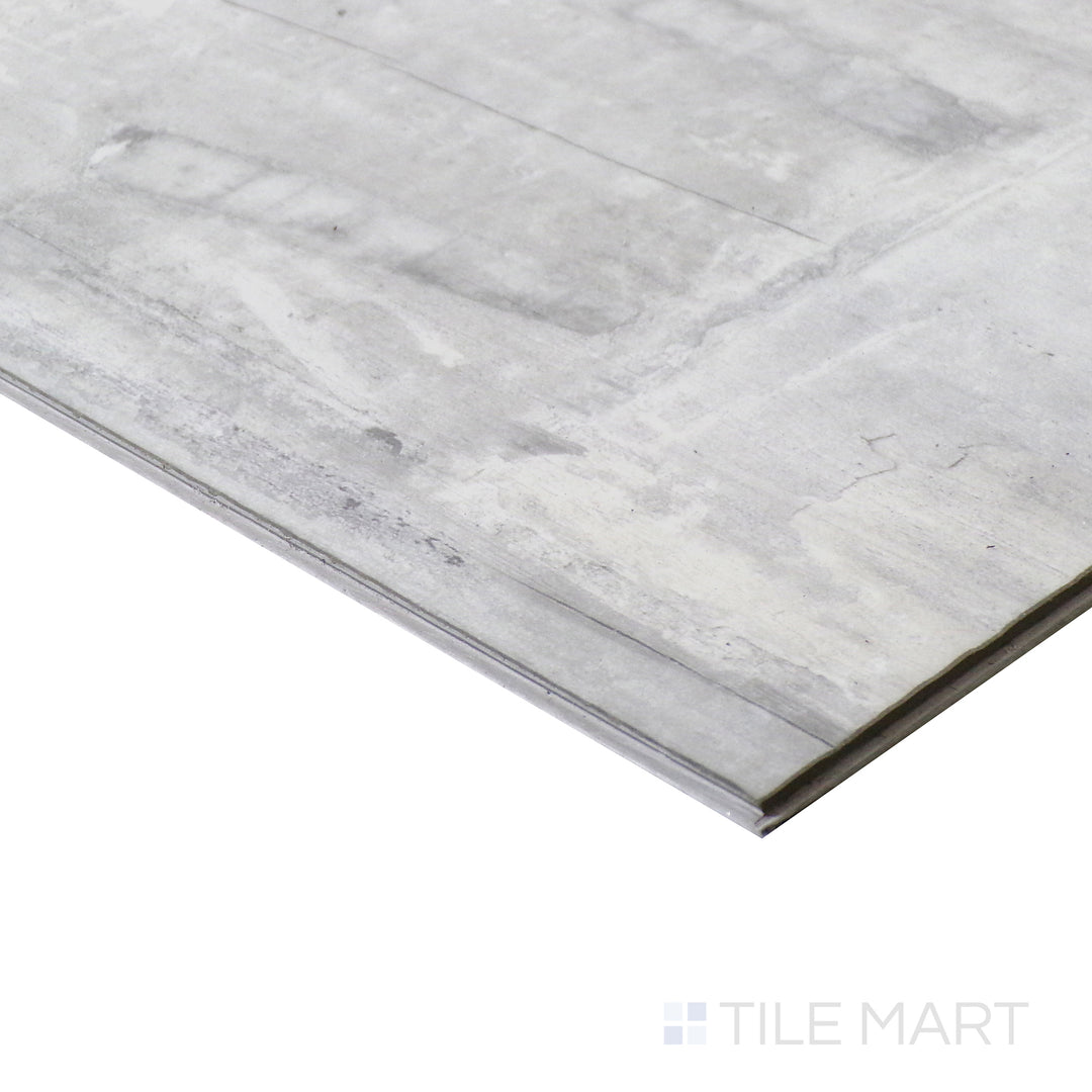 Corner shot of ANDOVER KINGSDOWN GRAY 7x48 VINYL TILE with a LOW GLOSS finish, emphasizing the layered construction and the product's distinct edge design.