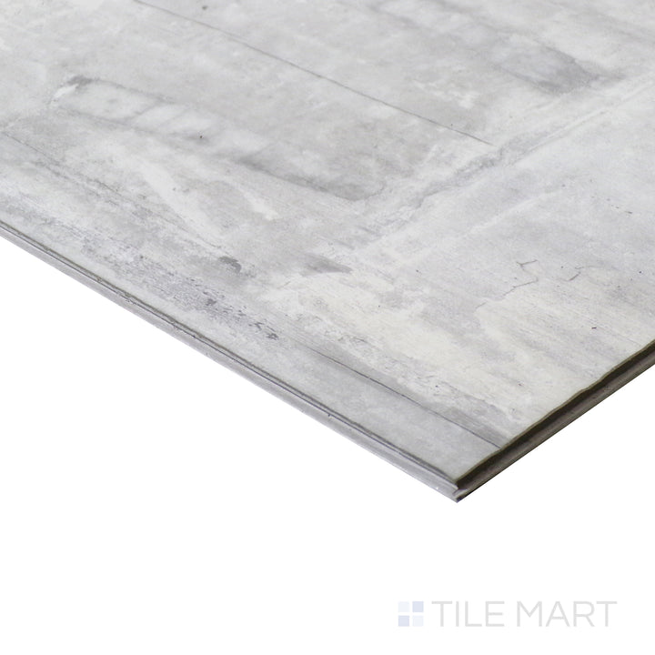 Corner shot of ANDOVER KINGSDOWN GRAY 7x48 VINYL TILE with a LOW GLOSS finish, emphasizing the layered construction and the product's distinct edge design.