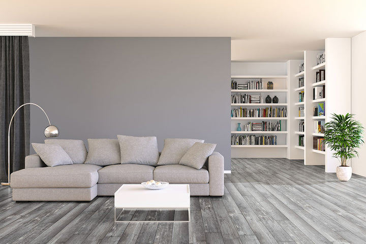 Soft gray wood tones and realistic textures create a cool and modern aesthetic, seamlessly integrating into contemporary interiors with Andover Kingsdown Gray 7x48 low gloss luxury plank vinyl.