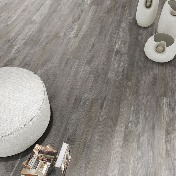 Modern living room showcasing Ashton Loton Hill 7x48 low gloss luxury vinyl plank flooring, featuring a warm wood aesthetic and realistic grain patterns for a cozy, contemporary interior.