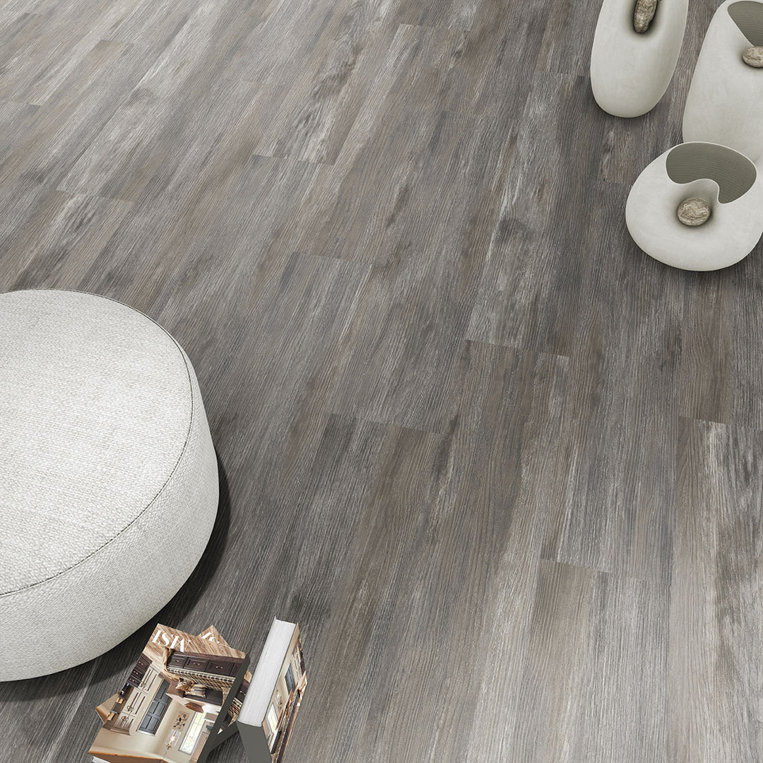 Modern living room showcasing Ashton Loton Hill 7x48 low gloss luxury vinyl plank flooring, featuring a warm wood aesthetic and realistic grain patterns for a cozy, contemporary interior.