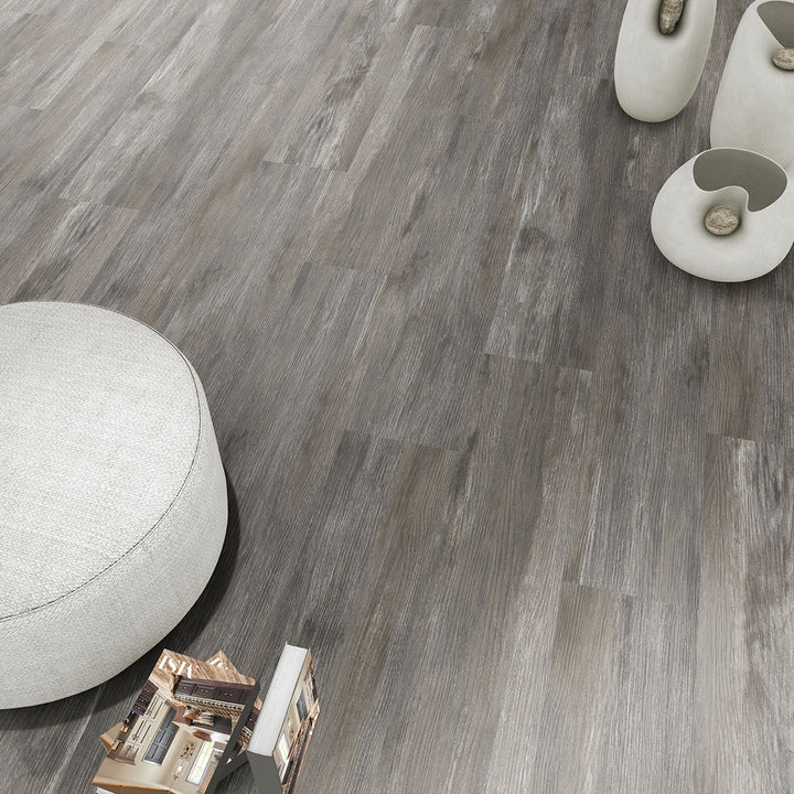 Modern living room showcasing Ashton Loton Hill 7x48 low gloss luxury vinyl plank flooring, featuring a warm wood aesthetic and realistic grain patterns for a cozy, contemporary interior.