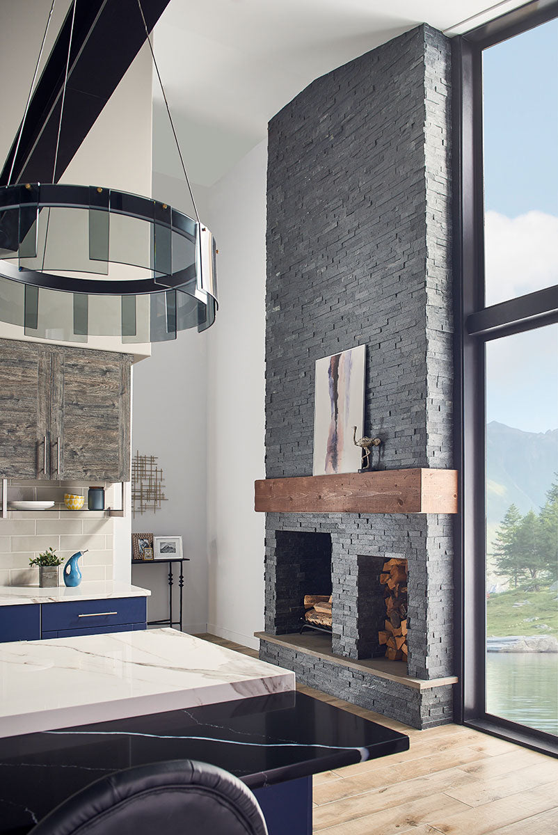 Deep charcoal and earthy hues create a striking contrast, adding depth and rugged elegance to the space.