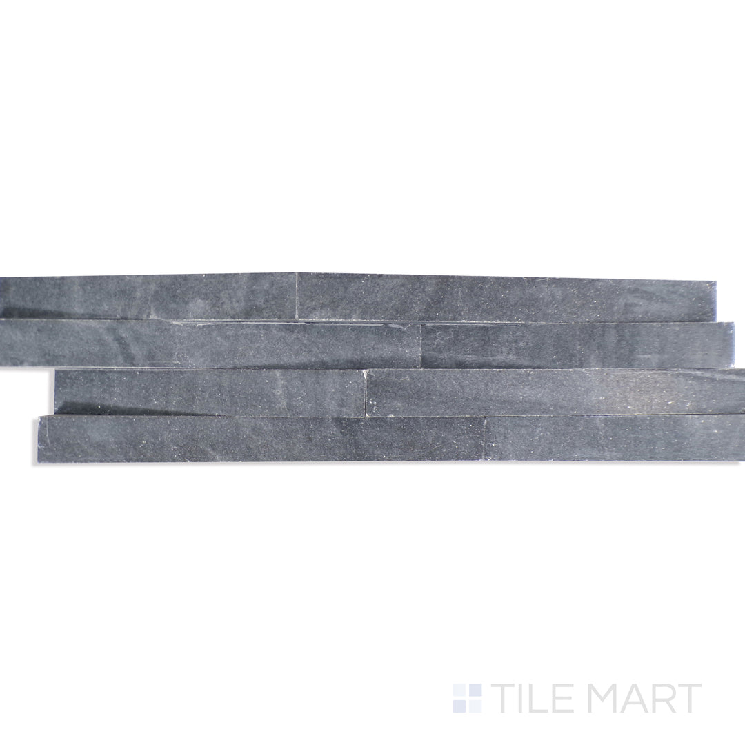 Angled shot of COSMIC BLACK 3D WAVE 6X24 PANEL MARBLE PANEL with a HONED finish, providing a sharp, angled view to emphasize the product's texture and quality.