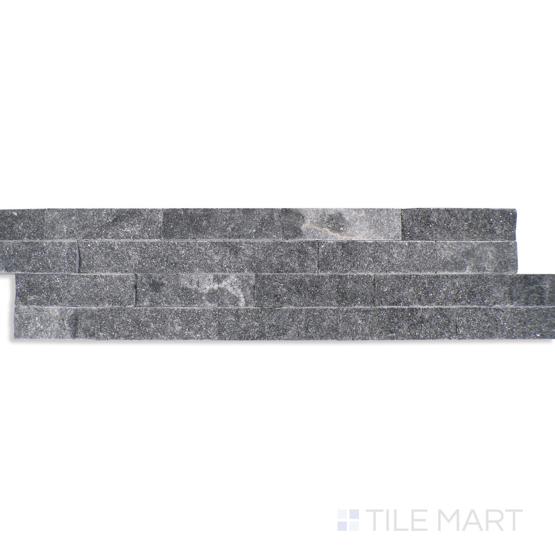 Angled shot of COSMIC BLACK SPLIT FACE 6X24 PANEL MARBLE PANEL with a SPLITFACE finish, revealing the depth of the product with a skewed visual perspective.