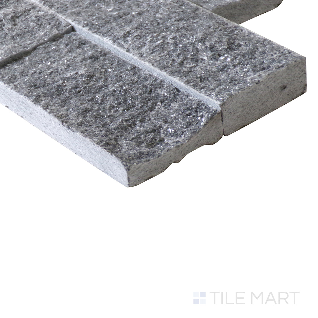 Corner shot of COSMIC BLACK SPLIT FACE 6X24 PANEL MARBLE PANEL with a SPLITFACE finish, capturing the thickness and material depth from an angled corner perspective.