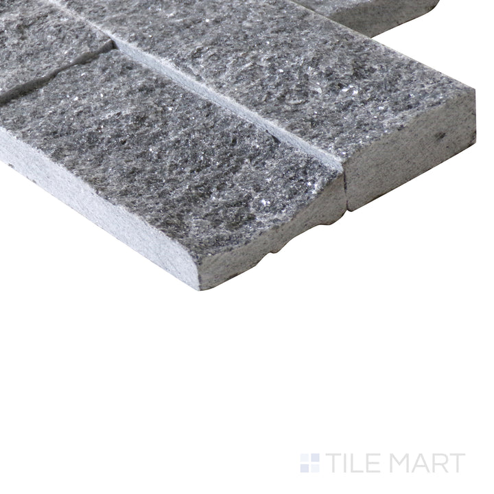 Corner shot of COSMIC BLACK SPLIT FACE 6X24 PANEL MARBLE PANEL with a SPLITFACE finish, capturing the thickness and material depth from an angled corner perspective.