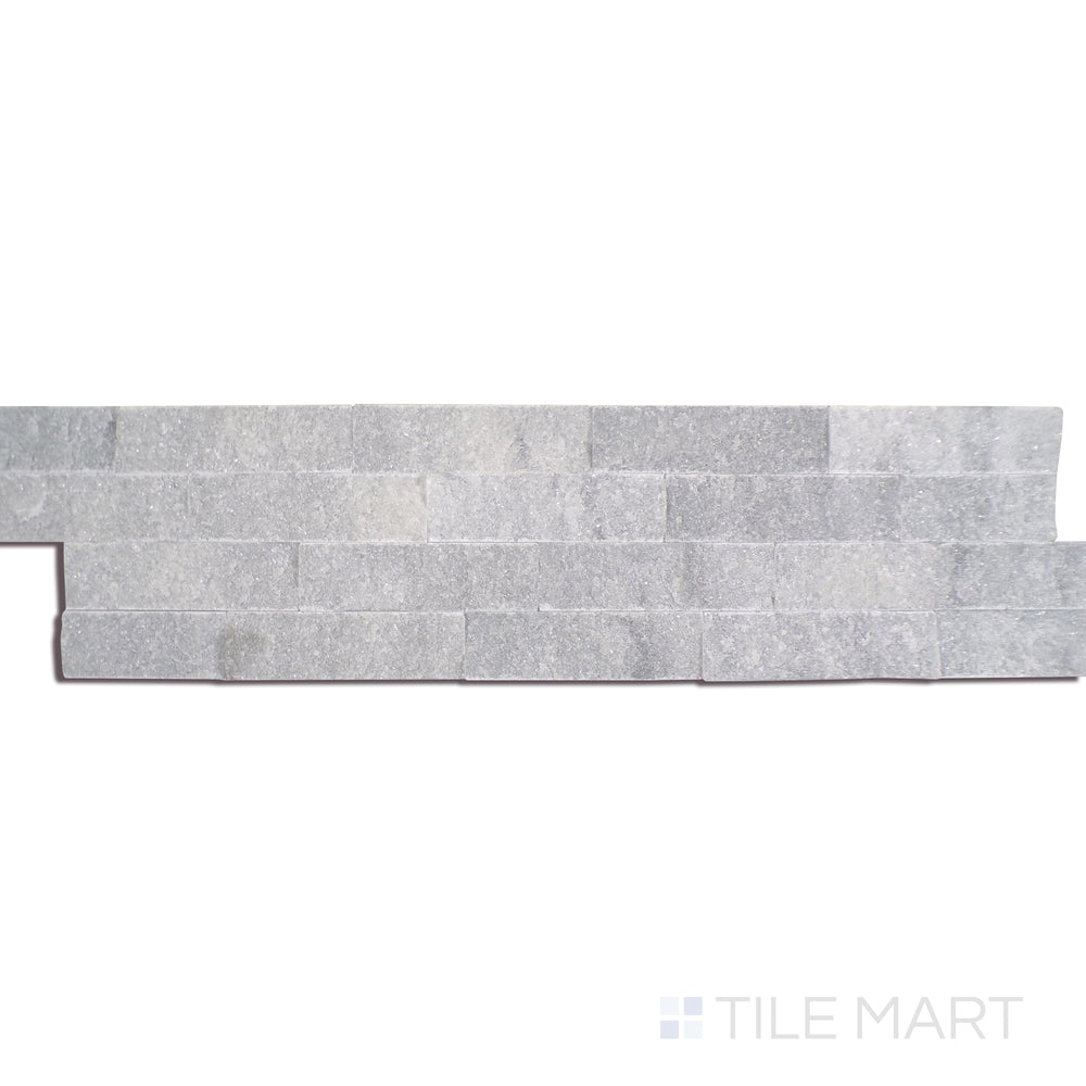 Angled shot of COSMIC GRAY SPLIT FACE 6X24 PANEL MARBLE PANEL with a SPLITFACE finish, revealing the depth of the product with a skewed visual perspective.