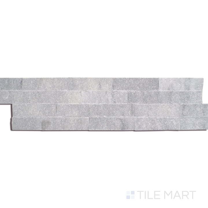 Angled shot of COSMIC GRAY SPLIT FACE 6X24 PANEL MARBLE PANEL with a SPLITFACE finish, revealing the depth of the product with a skewed visual perspective.