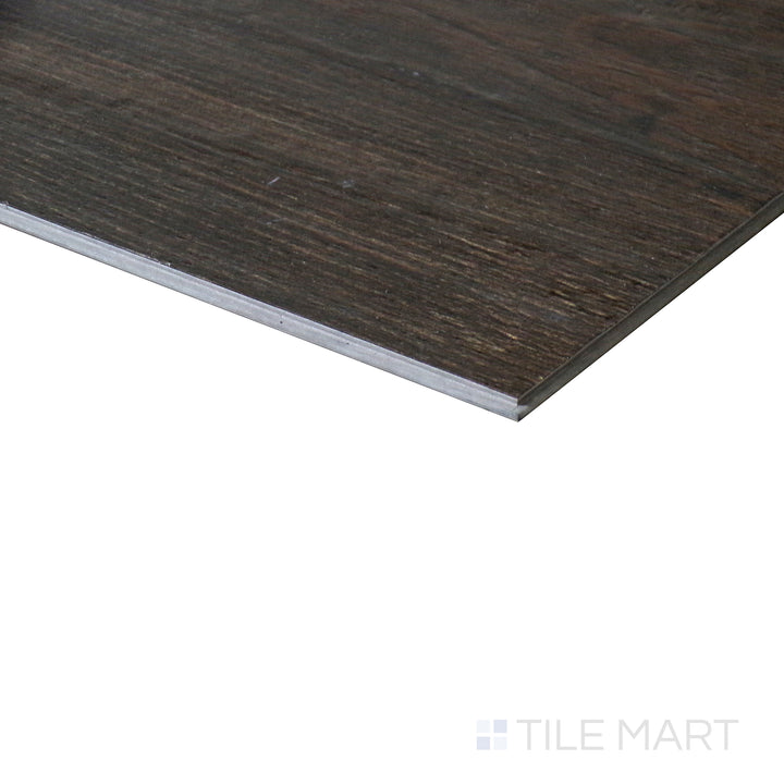 Corner shot of CYRUS WALNUT WAVES 7x48 VINYL TILE with a LOW GLOSS finish, highlighting the precision of the product's edge and the substantial thickness.