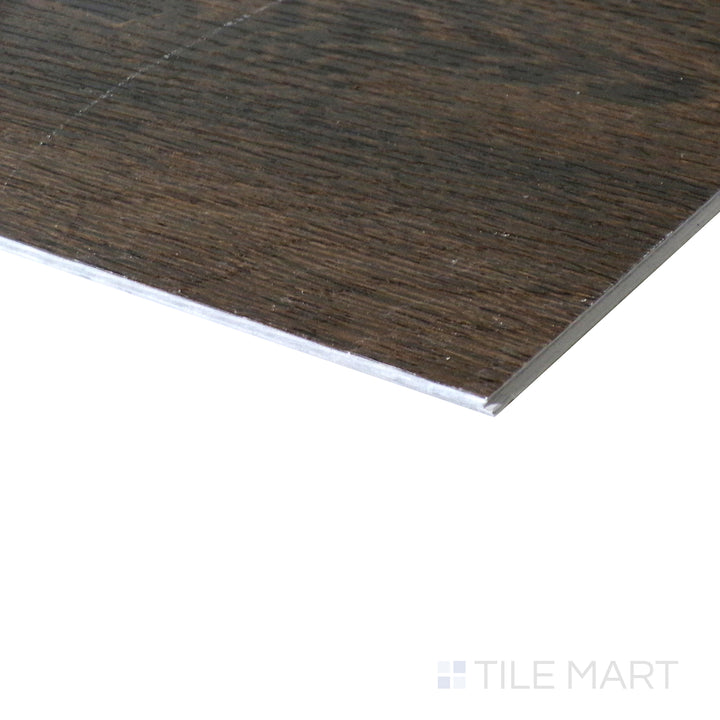 Corner shot of XL CYRUS DRAVEN 9x60 VINYL TILE with a LOW GLOSS finish, showing the robust material and finely finished edge through a focused corner view.