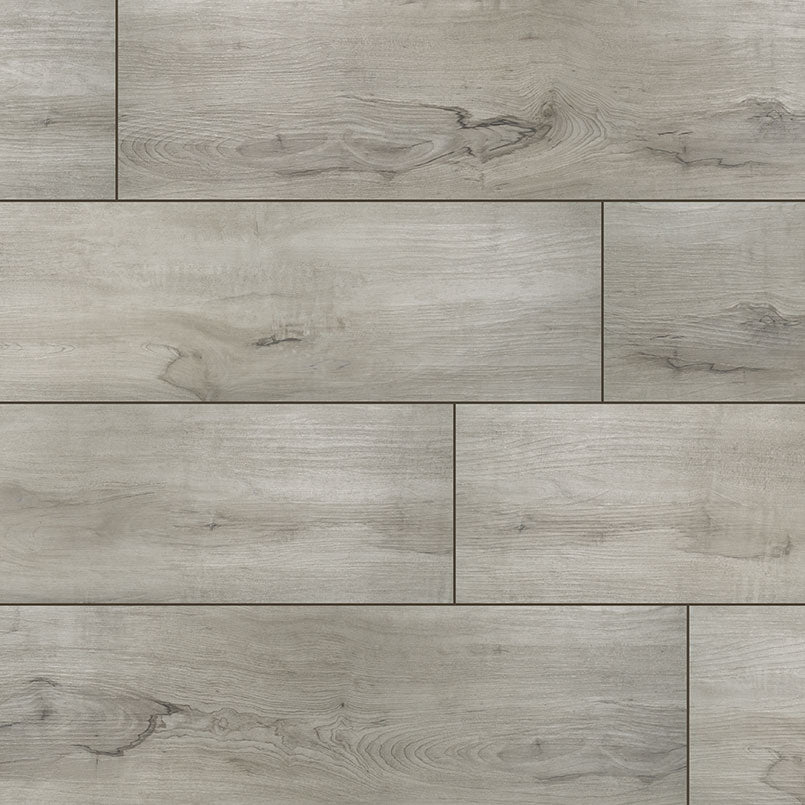 Top-down view of XL CYRUS DUNITE OAK 9x60 VINYL TILE in LOW GLOSS finish, displaying the surface and subtle tonal variations.