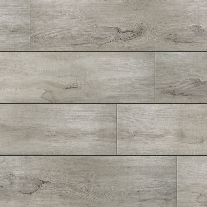 Top-down view of XL CYRUS DUNITE OAK 9x60 VINYL TILE in LOW GLOSS finish, displaying the surface and subtle tonal variations.