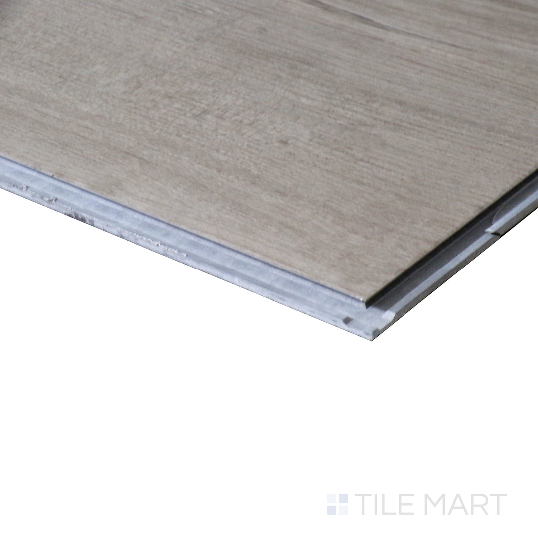 Corner shot of XL CYRUS DUNITE OAK 9x60 VINYL TILE with a LOW GLOSS finish, revealing the intricate edge detailing and thickness from a corner viewpoint.