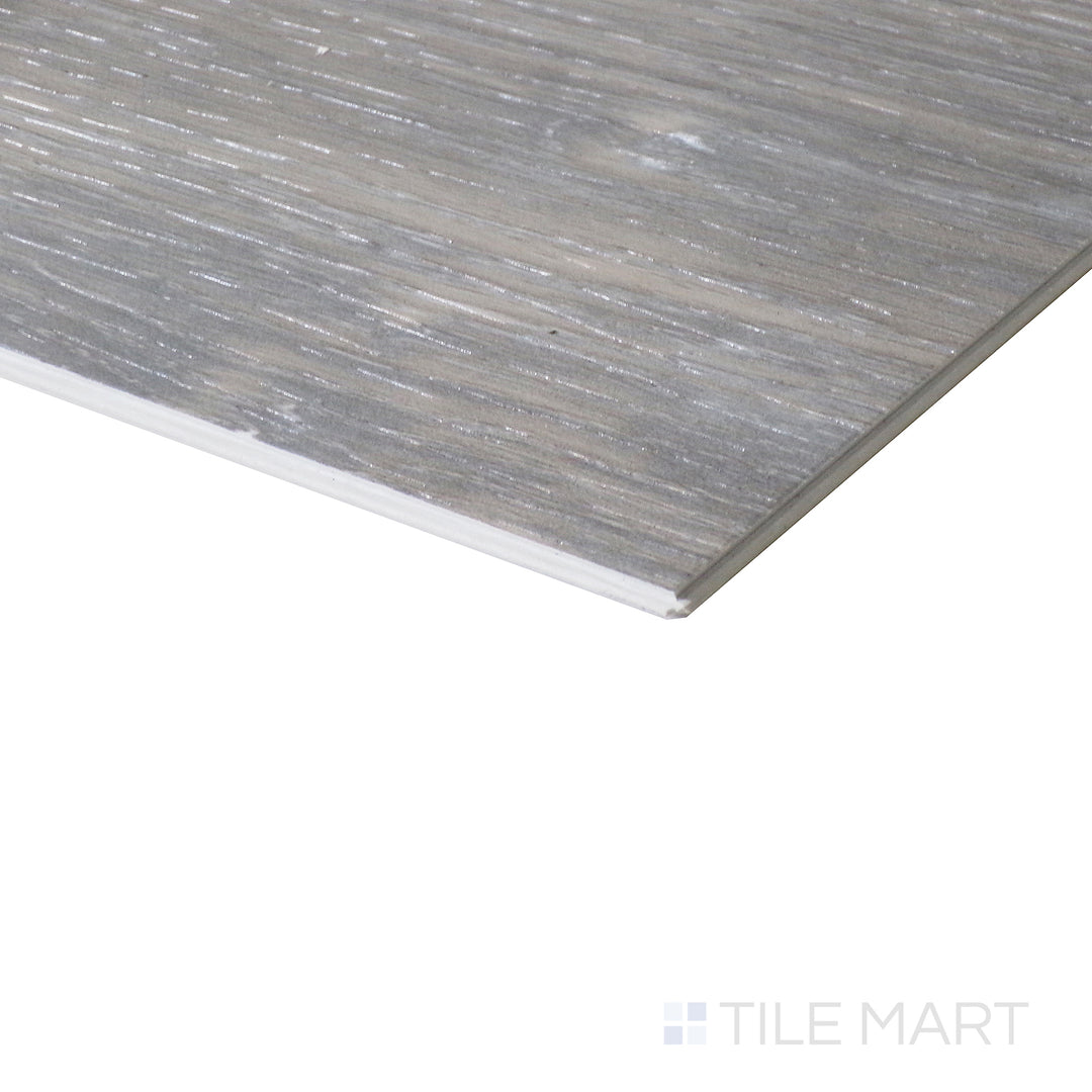 Corner shot of XL CYRUS FINELY  9x60 VINYL TILE with a LOW GLOSS finish, highlighting the precision of the product's edge and the substantial thickness.