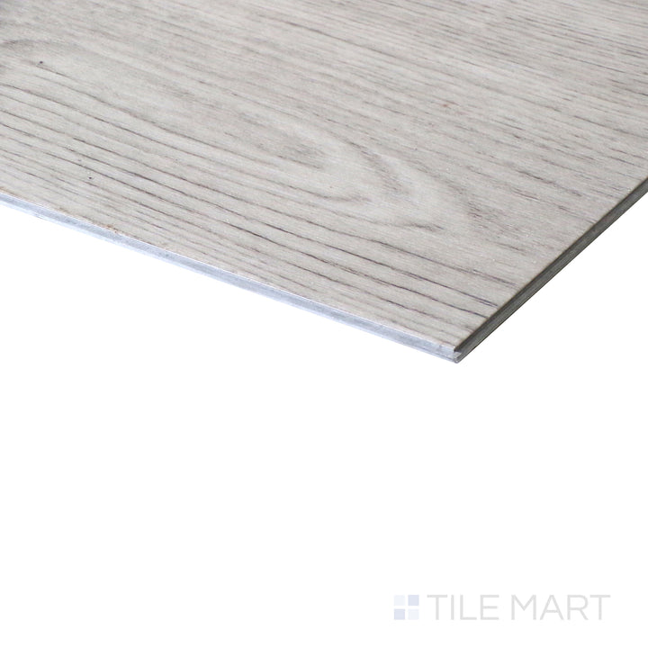 Corner shot of XL CYRUS KARDIGAN 9x60 VINYL TILE with a LOW GLOSS finish, revealing the intricate edge detailing and thickness from a corner viewpoint.