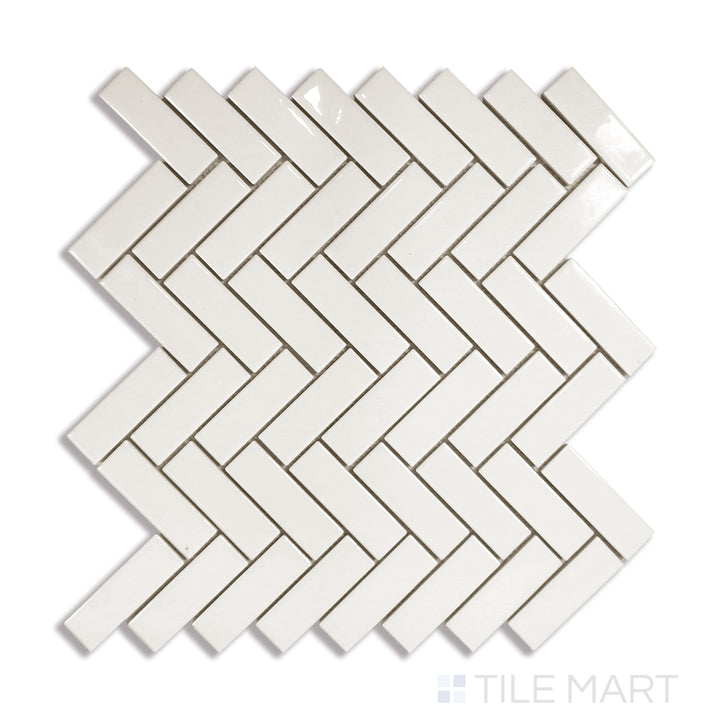 Angled shot of ALMOND GLOSSY HERRINGBONE MOSAIC PORCELAIN MOSAIC with a GLOSSY finish, providing a sharp, angled view to emphasize the product's texture and quality.