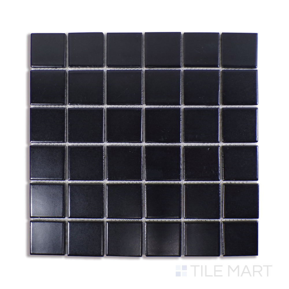 Angled shot of BLACK 2X2 MOSAIC MATTE PORCELAIN MOSAIC with a MATTE finish, offering a detailed look at the material's finish with a tilted viewpoint.