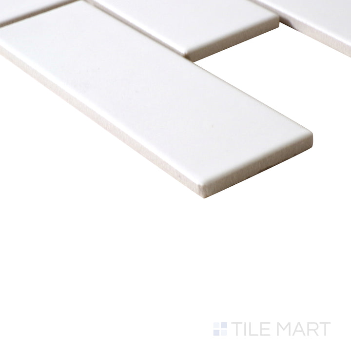 Corner shot of WHITE GLOSSY 2X4X6MM PORCELAIN MOSAIC with a GLOSSY finish, capturing the thickness and material depth from an angled corner perspective.